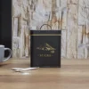 BOITE METAL NOIR ET DORE SUCRE
